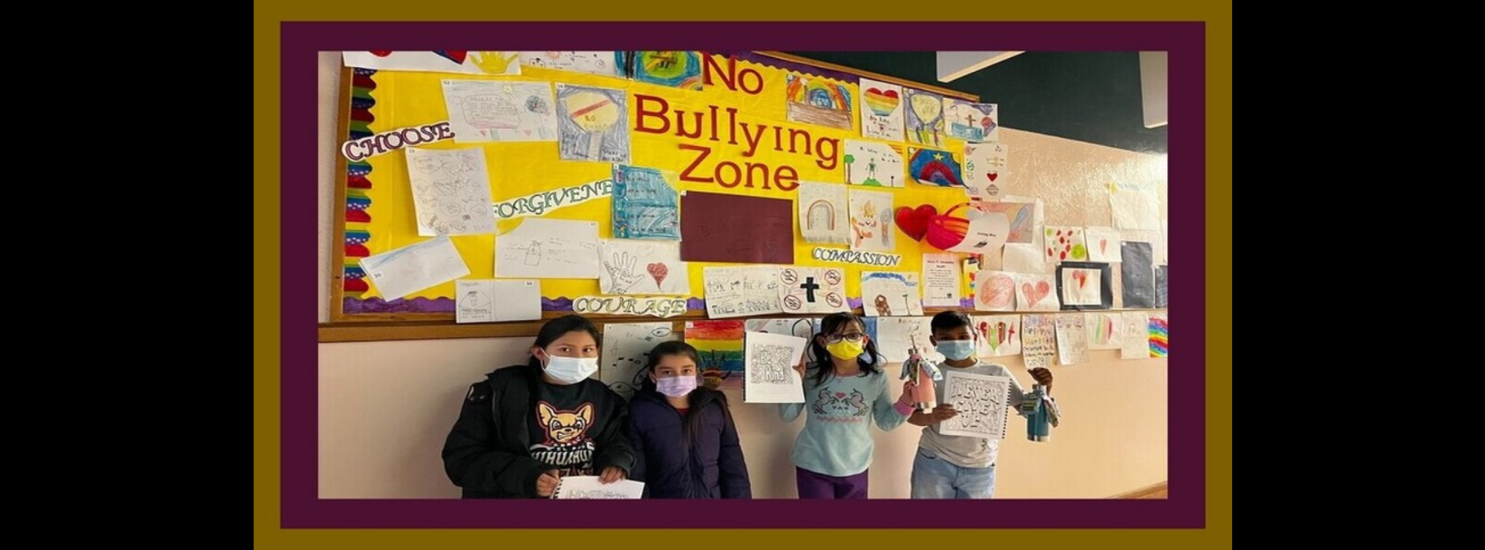 Students in front of no bullying zone sign! 