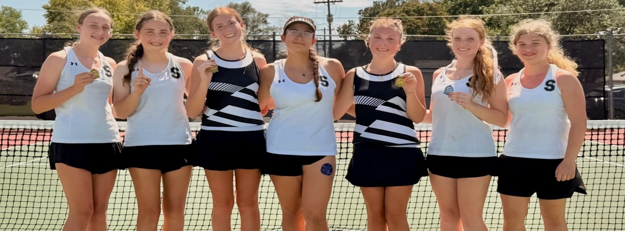 SHS varsity tennis players with medals after local meet. Photo provided by Coach Ryan.