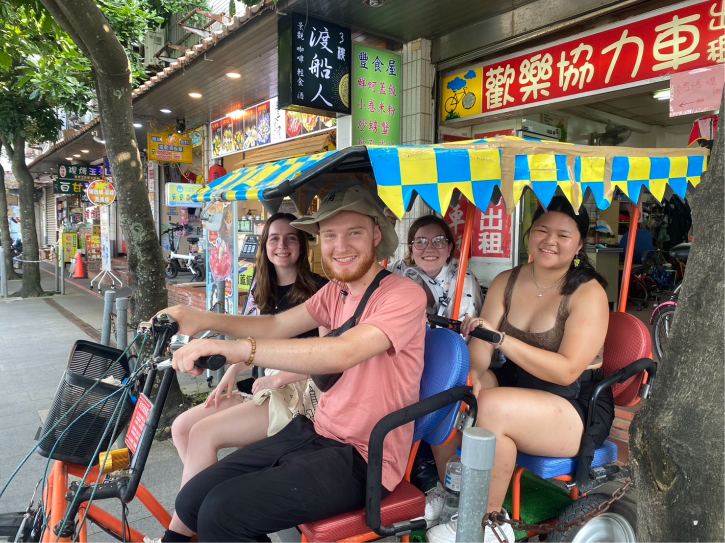 four students in bicycle cart in Taipei