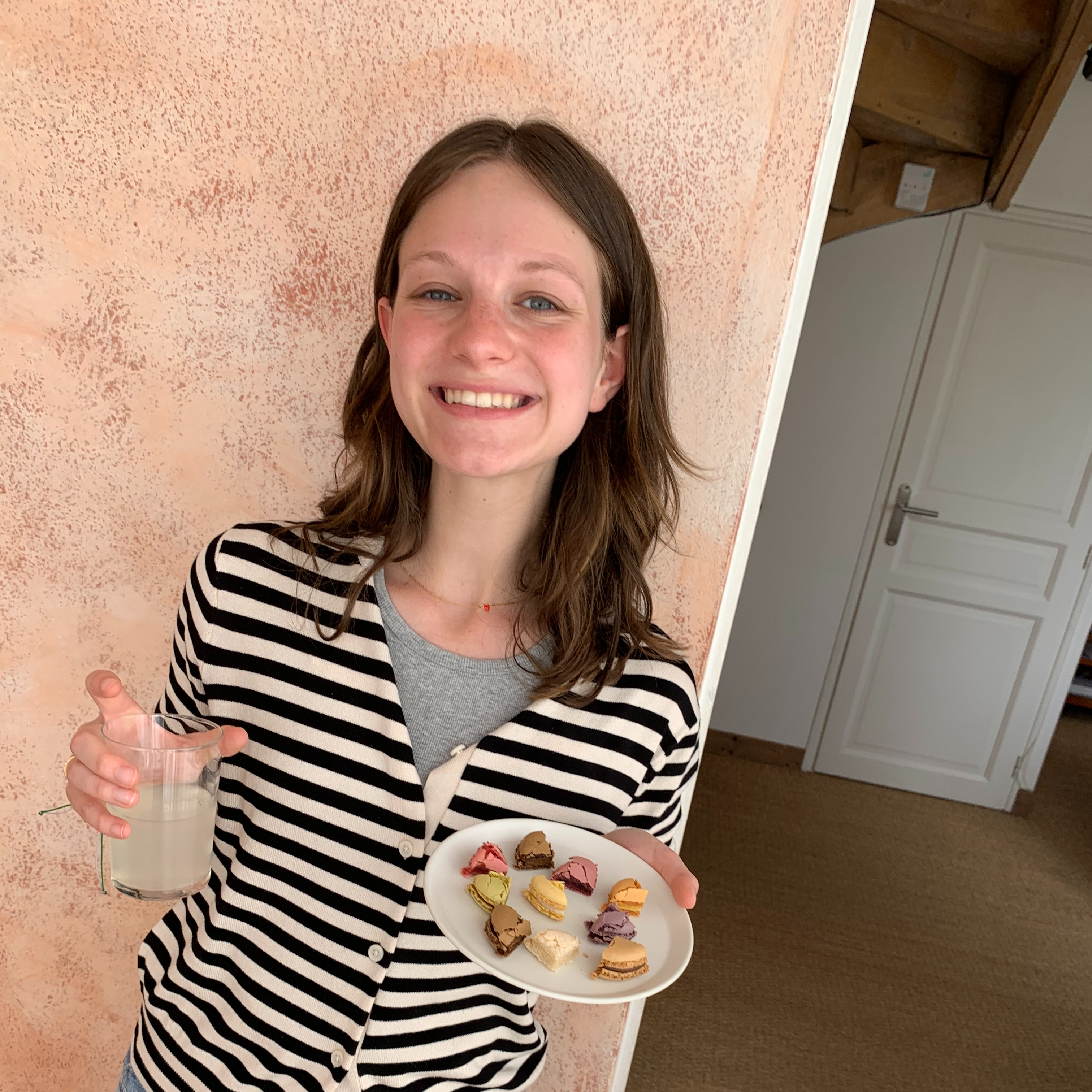 Student in Tours, France with a plate of macaroons