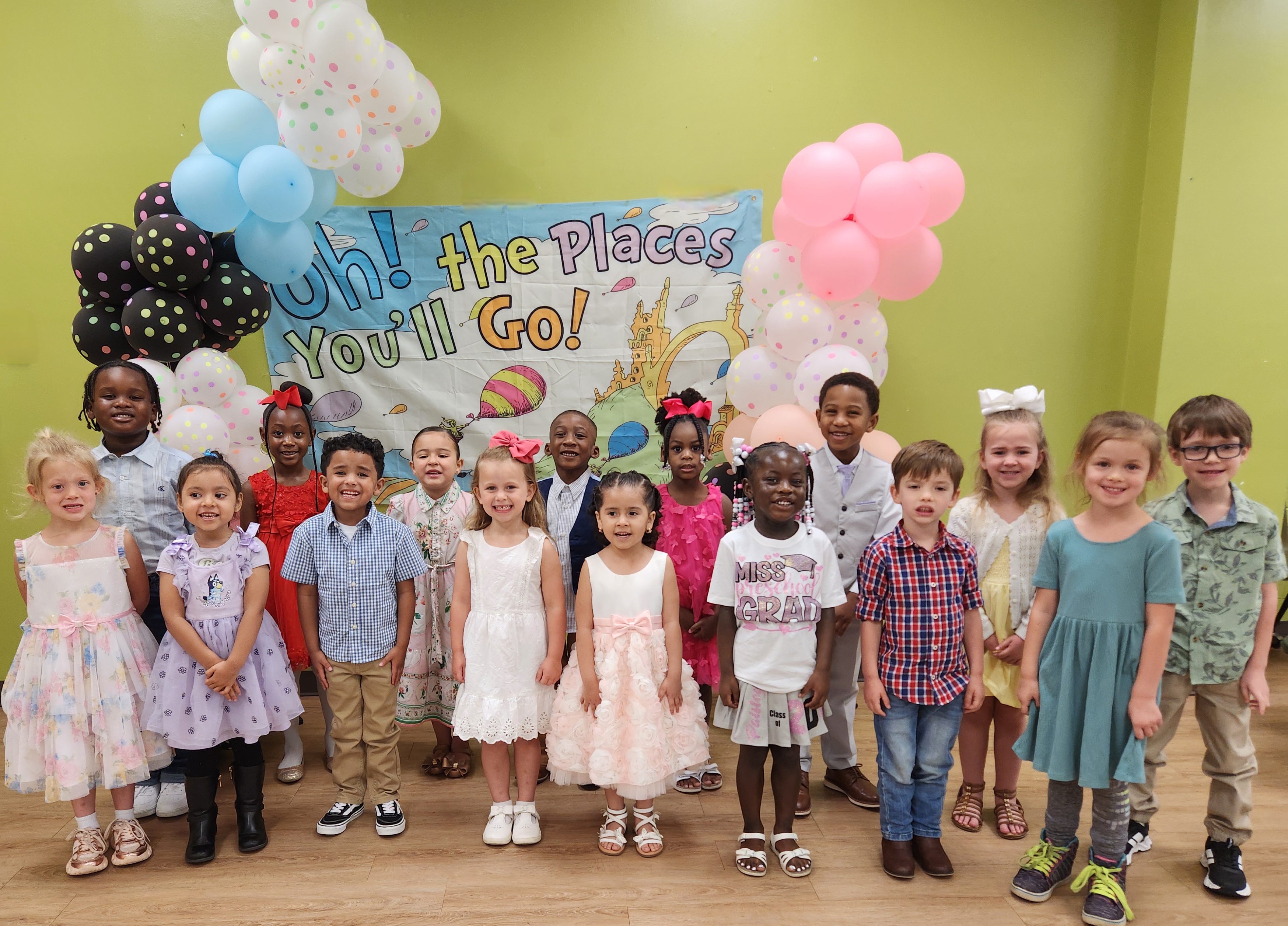 Pre-K graduates dressed up for a group picture.