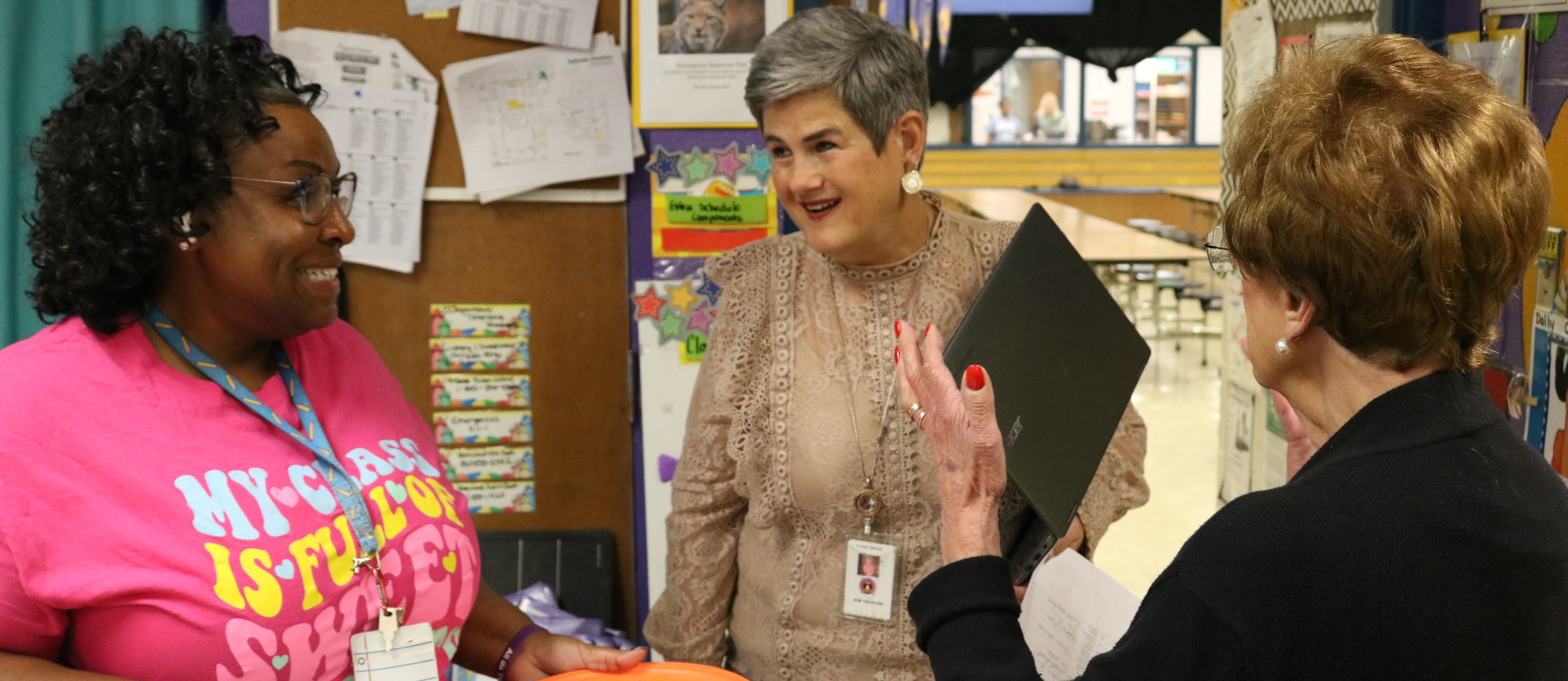 Principal Kim Truslow smiling with others in Oakbrooke Elementary