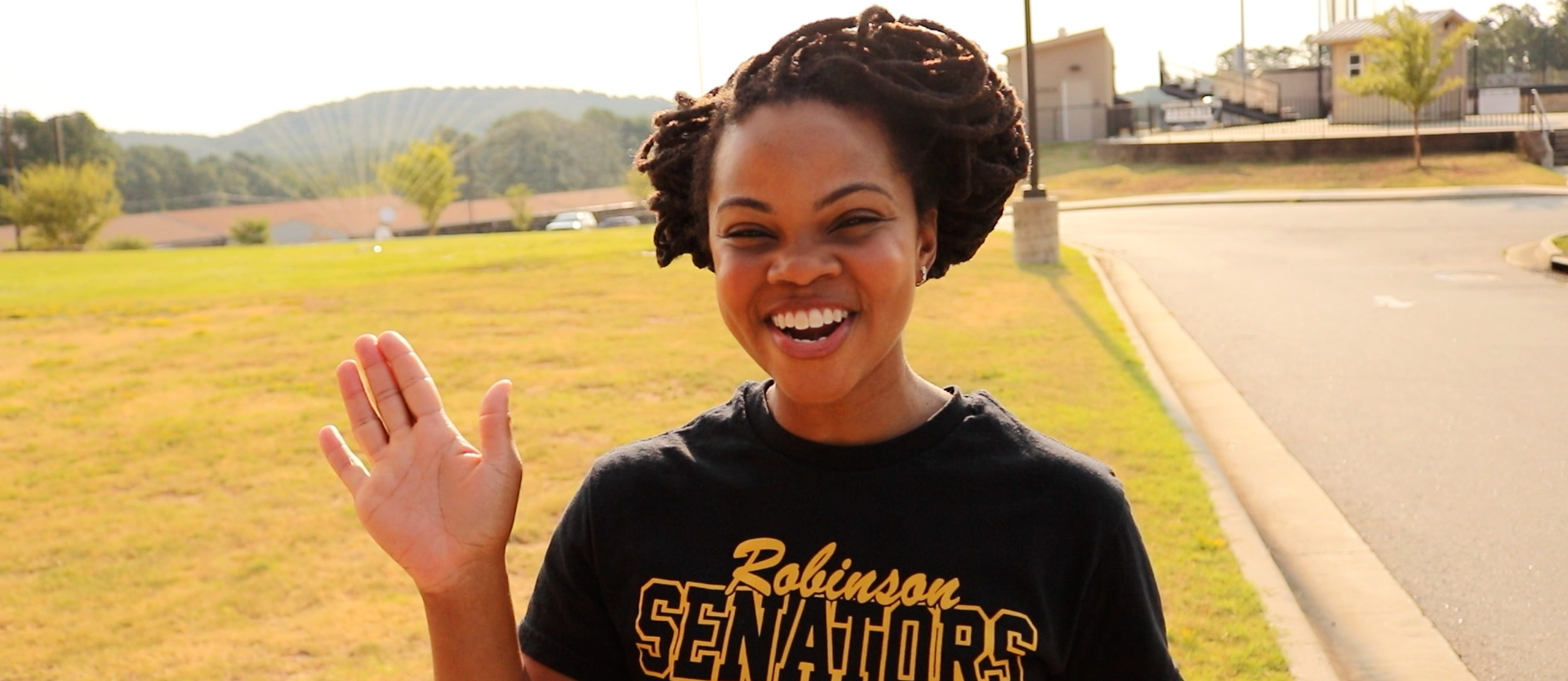 Principal Elise Hampton waving