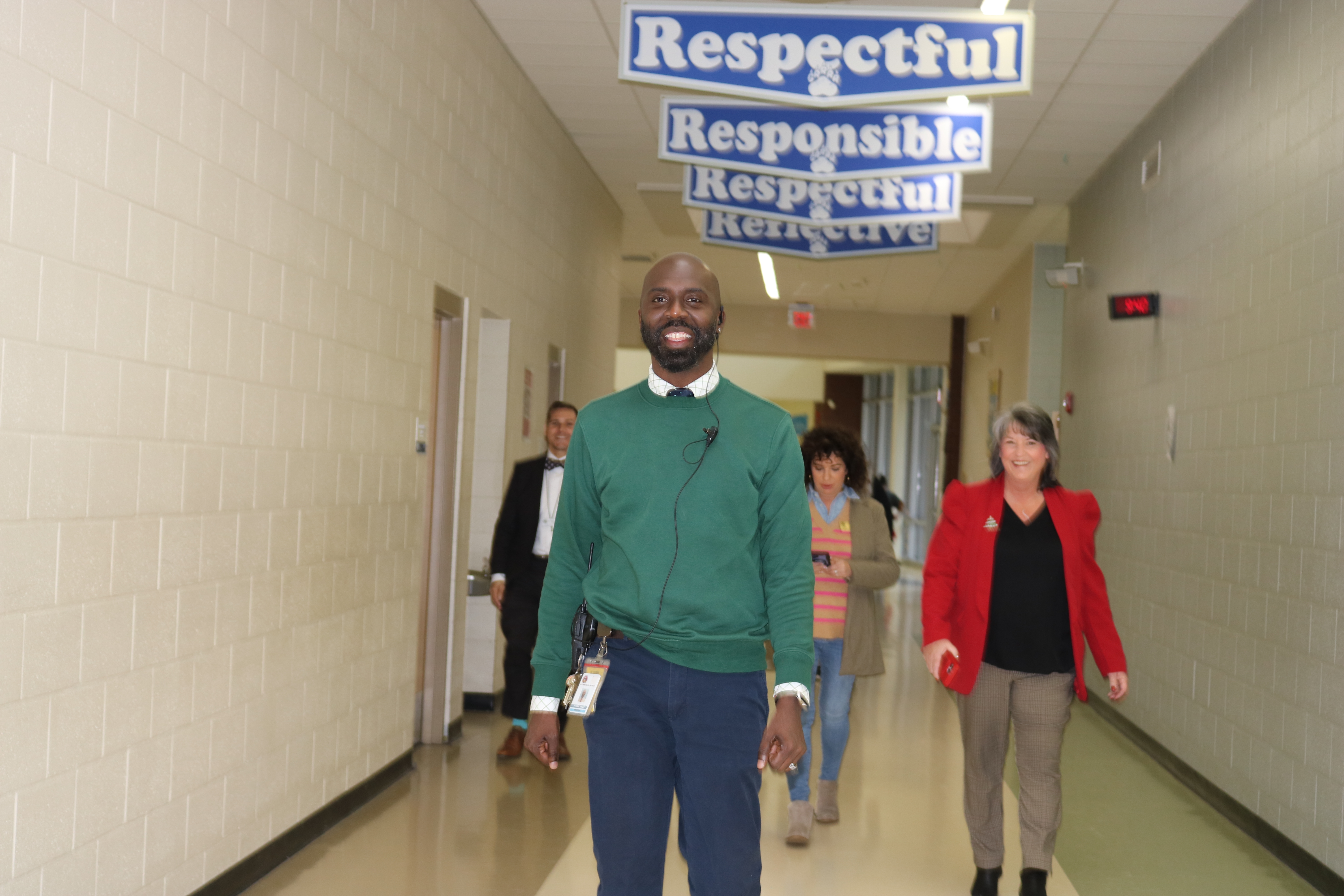 Dr. Yvone West walking down the hall of Sylvan Hills Junior High