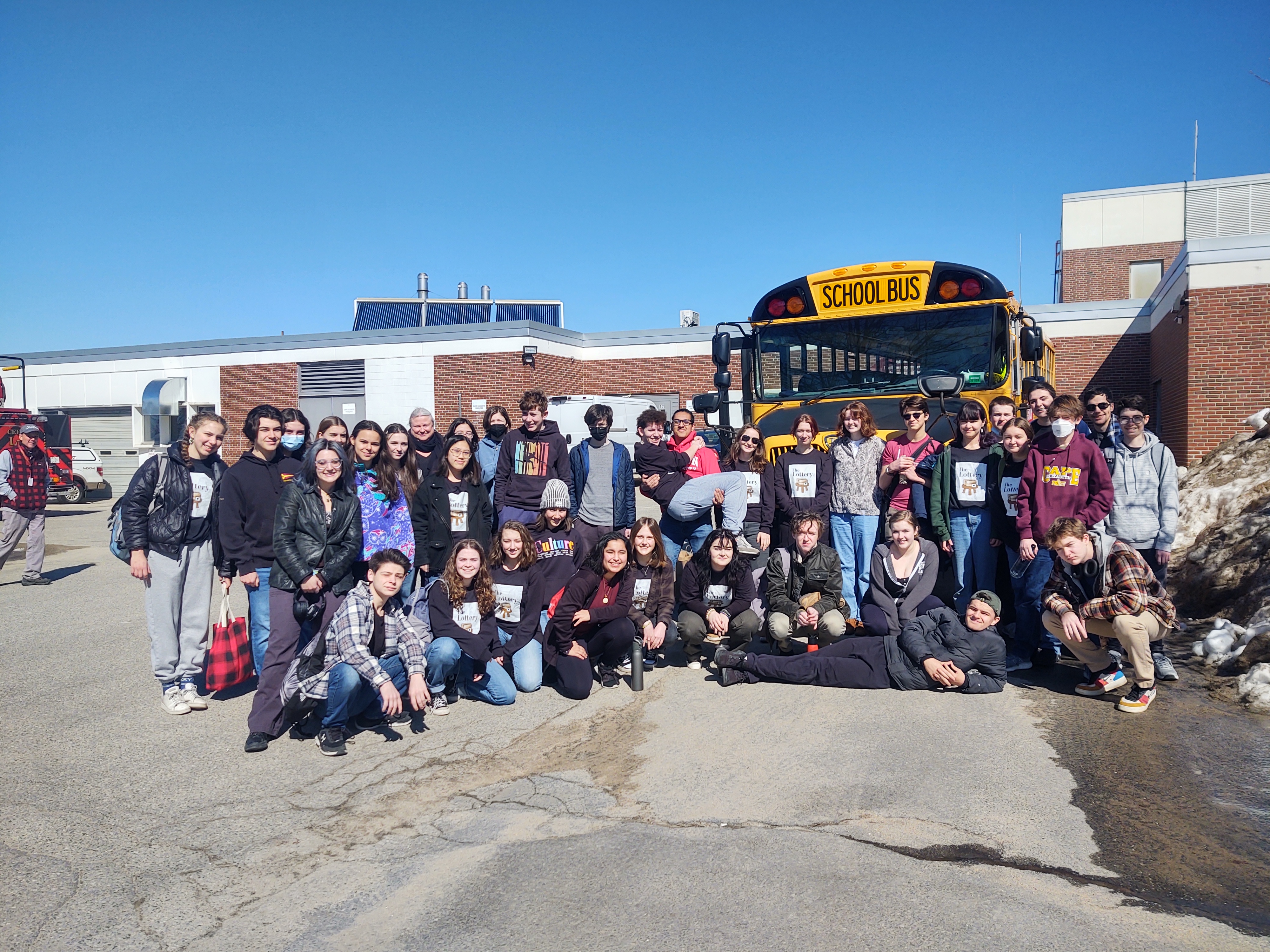 HS Students in front of a school bus before leaving for the One Act Play