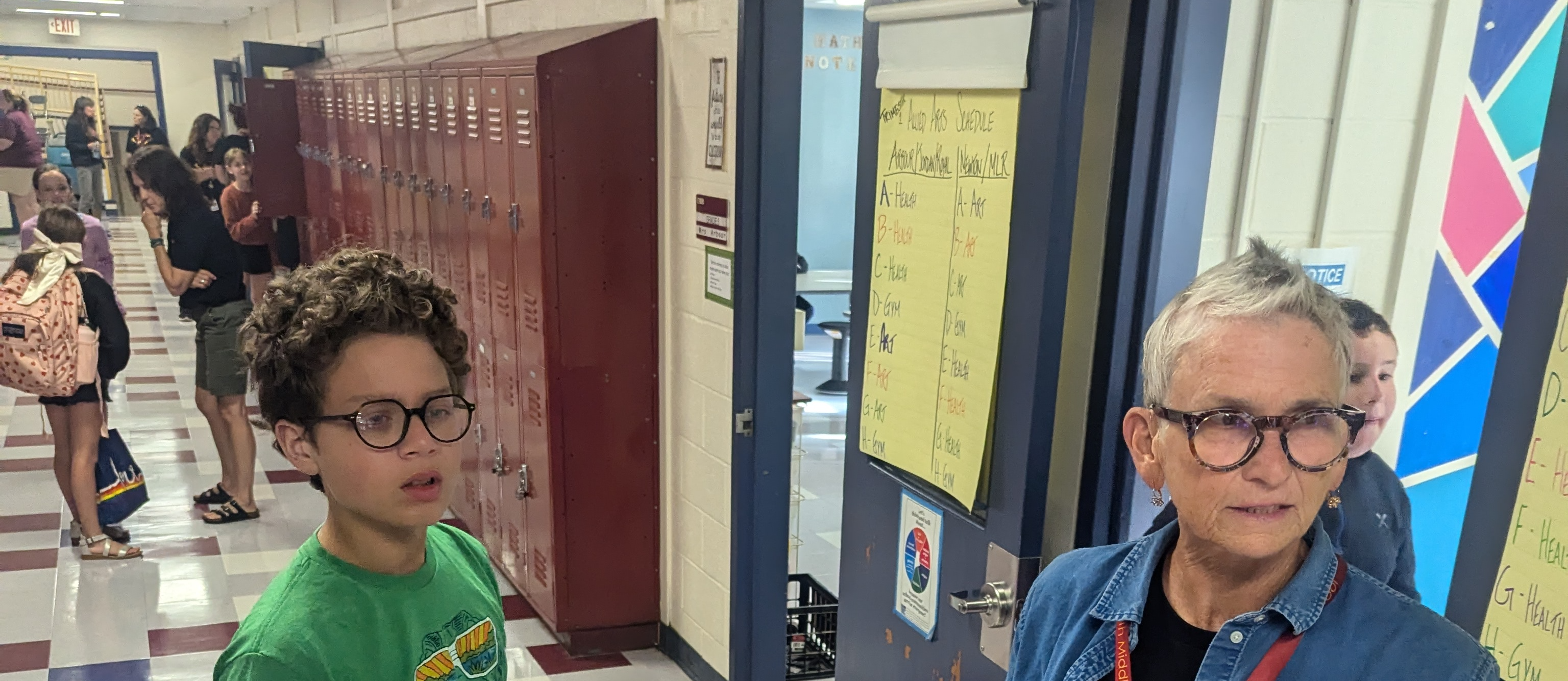 teacher and students in the hallway