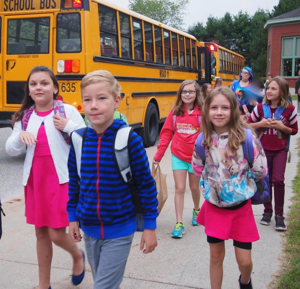 Children getting off school bus