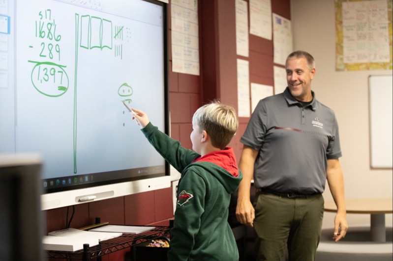 Student and teacher at the board