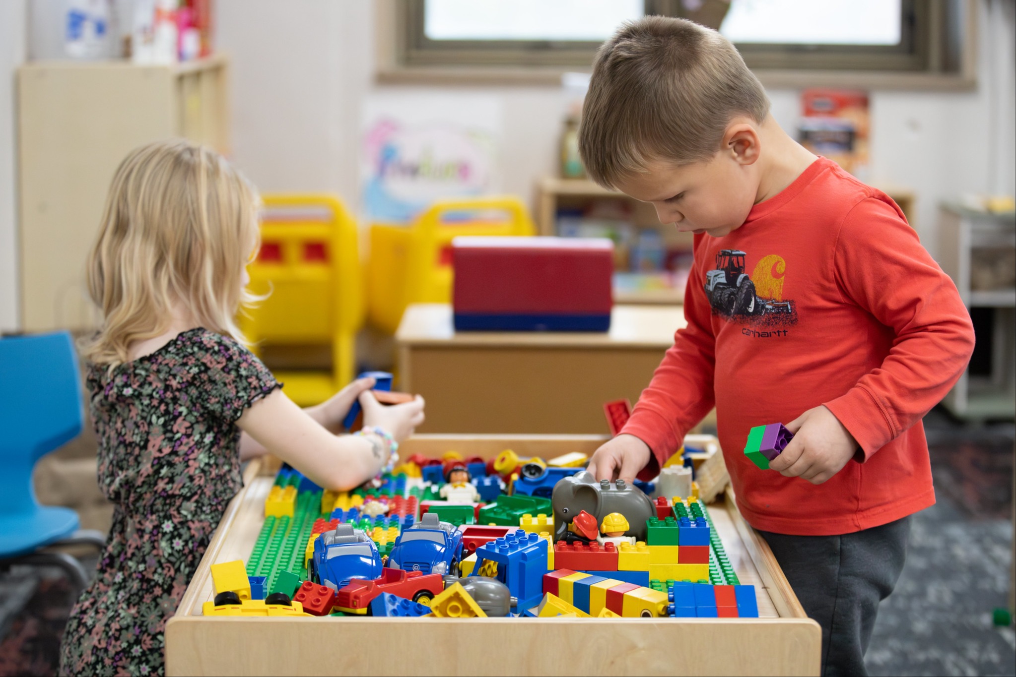 Students playing with lego bricks