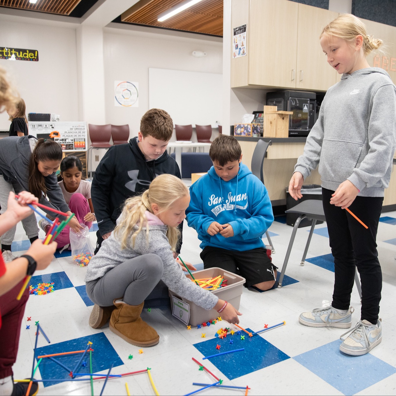 Students using completing a building challenge