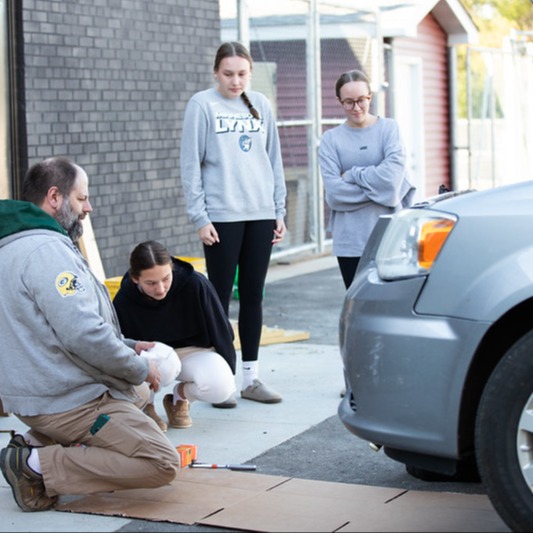 Students working on a car