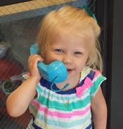 A small child on a toy phone