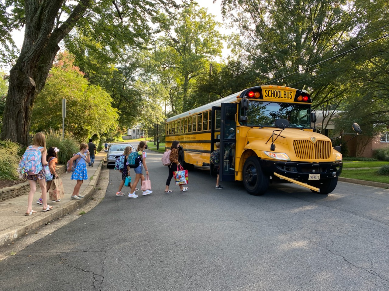 Children getting onto a School Bus 