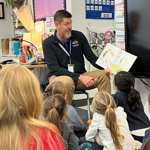 Dr. Noonan reading to students