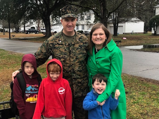 The Canvan family - a soldier in fatigues, his wife and three children