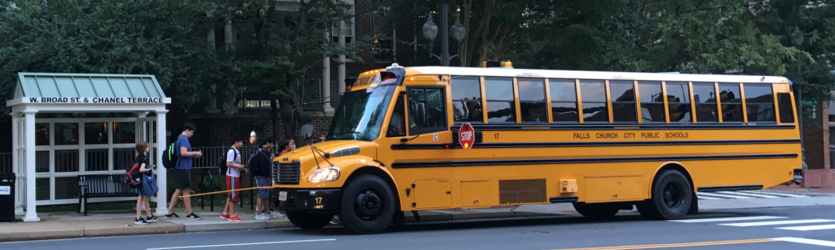 Students getting on a Falls Church School bus