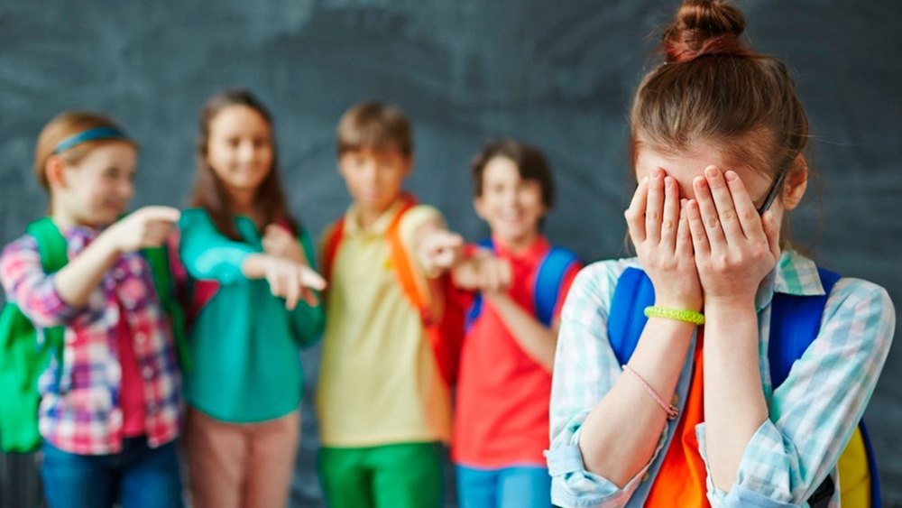 children pointing at another child