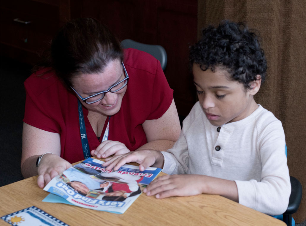 TEACHER WORKING WITH STUDENT