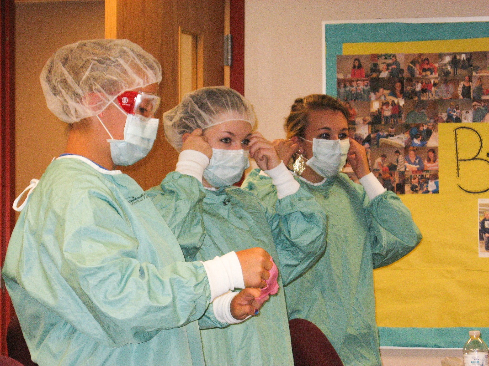 CNA students model personal protection equipment