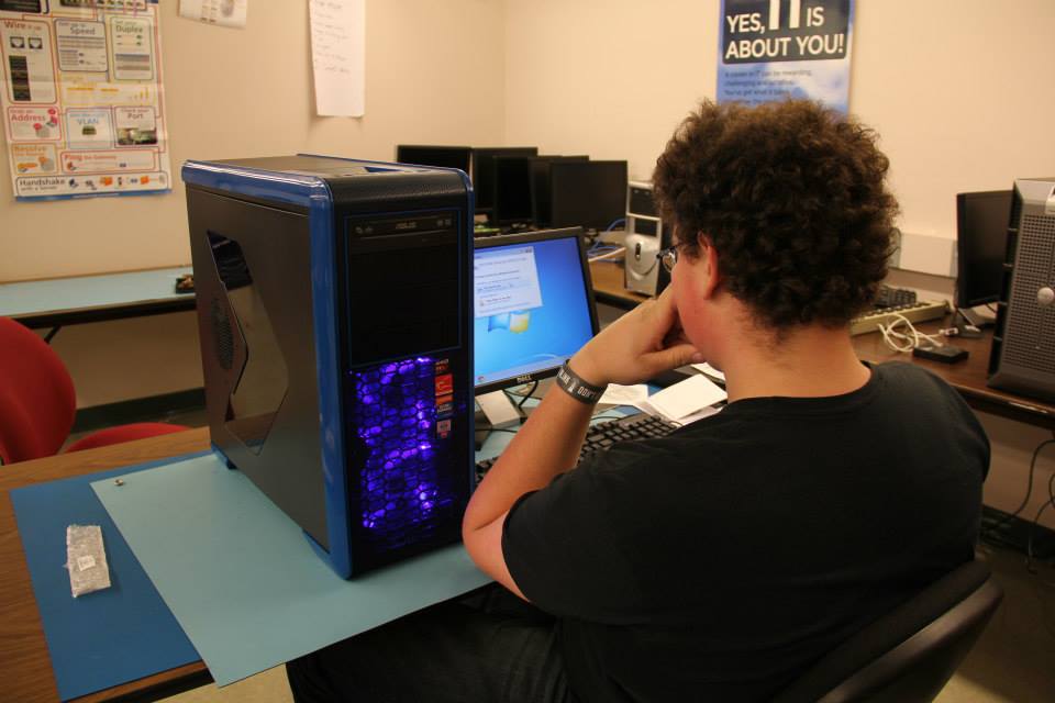 Student using the computer he built