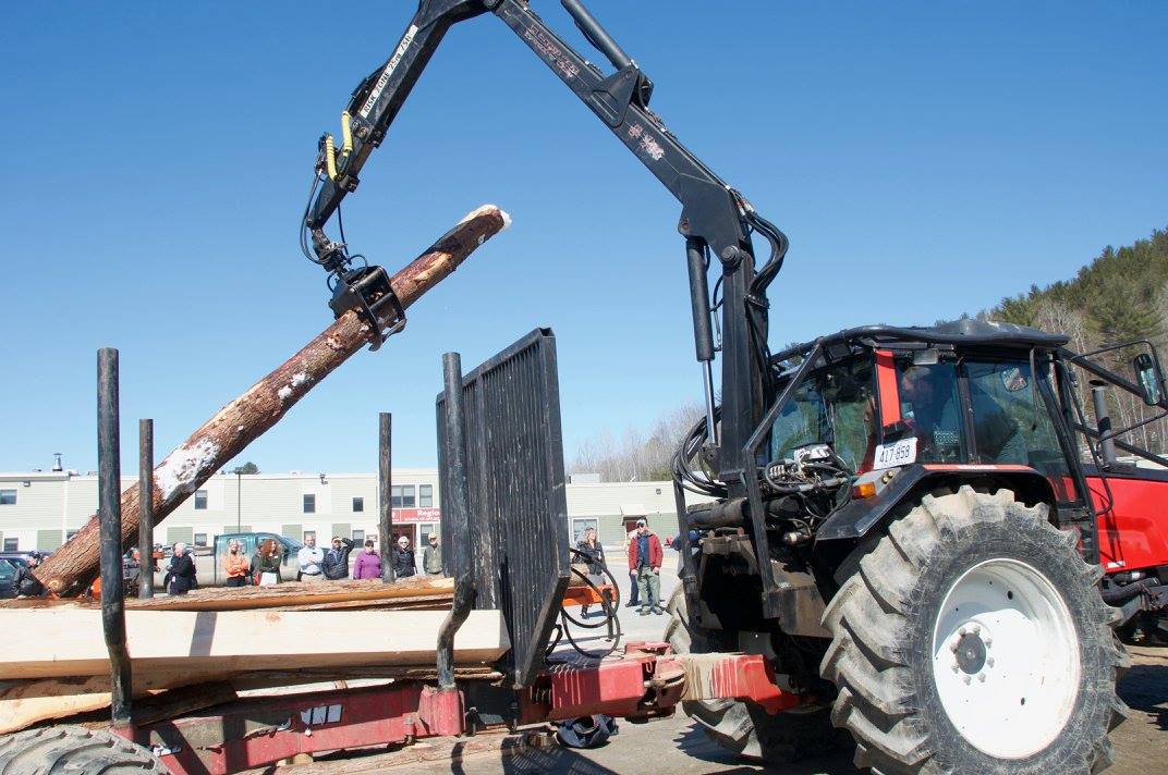 Student moving log with equipment