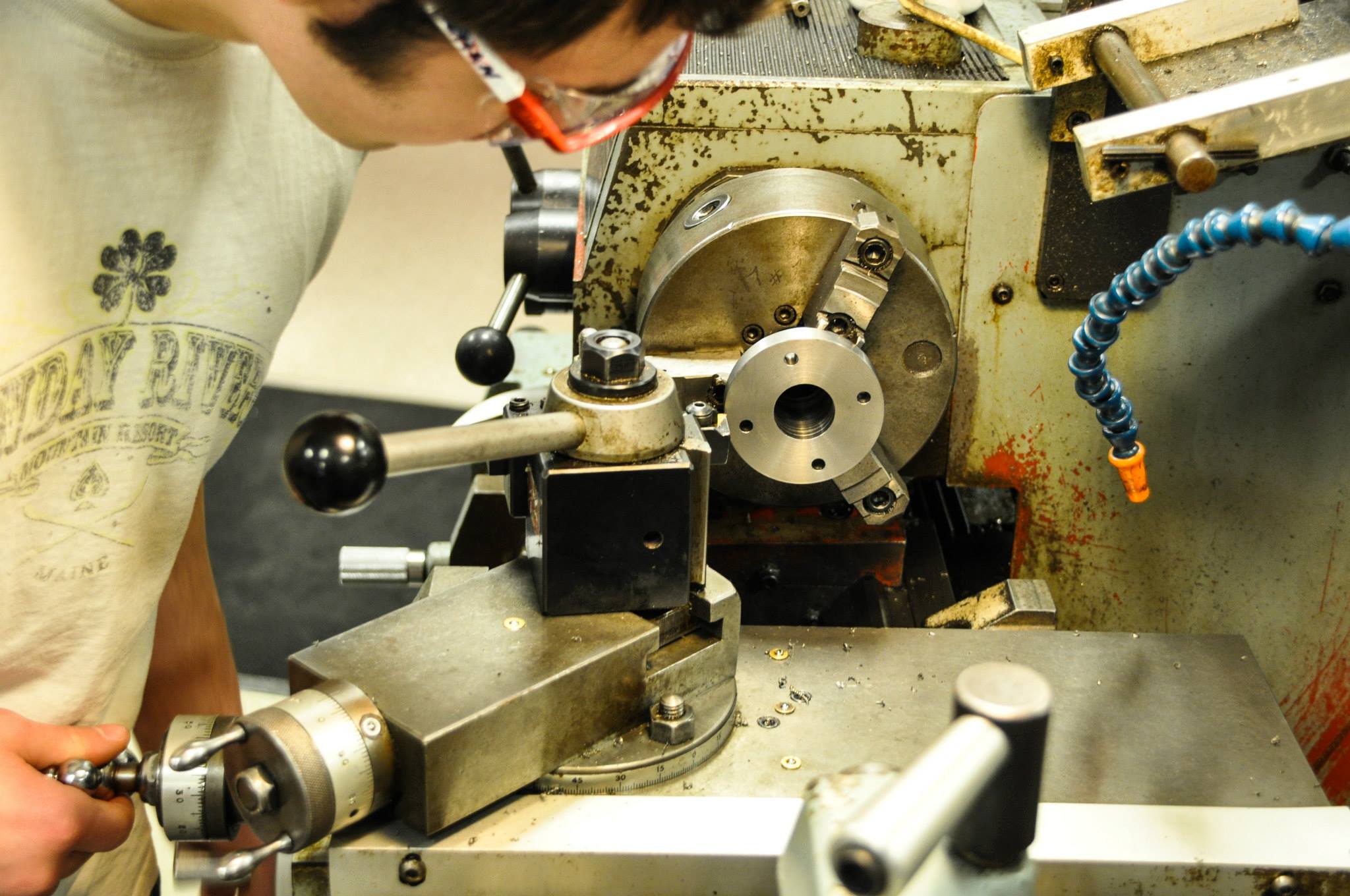 Student operating precision machinery