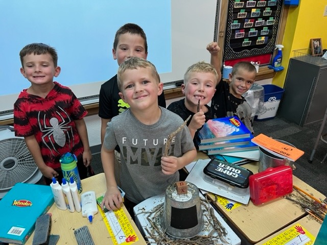 Second graders work in science class.