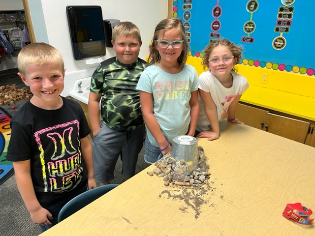 Second graders work in science class.