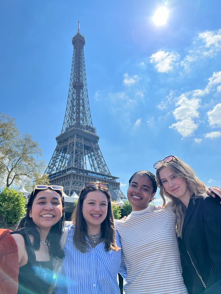 Jamila at the base of the Eiffel Tower 