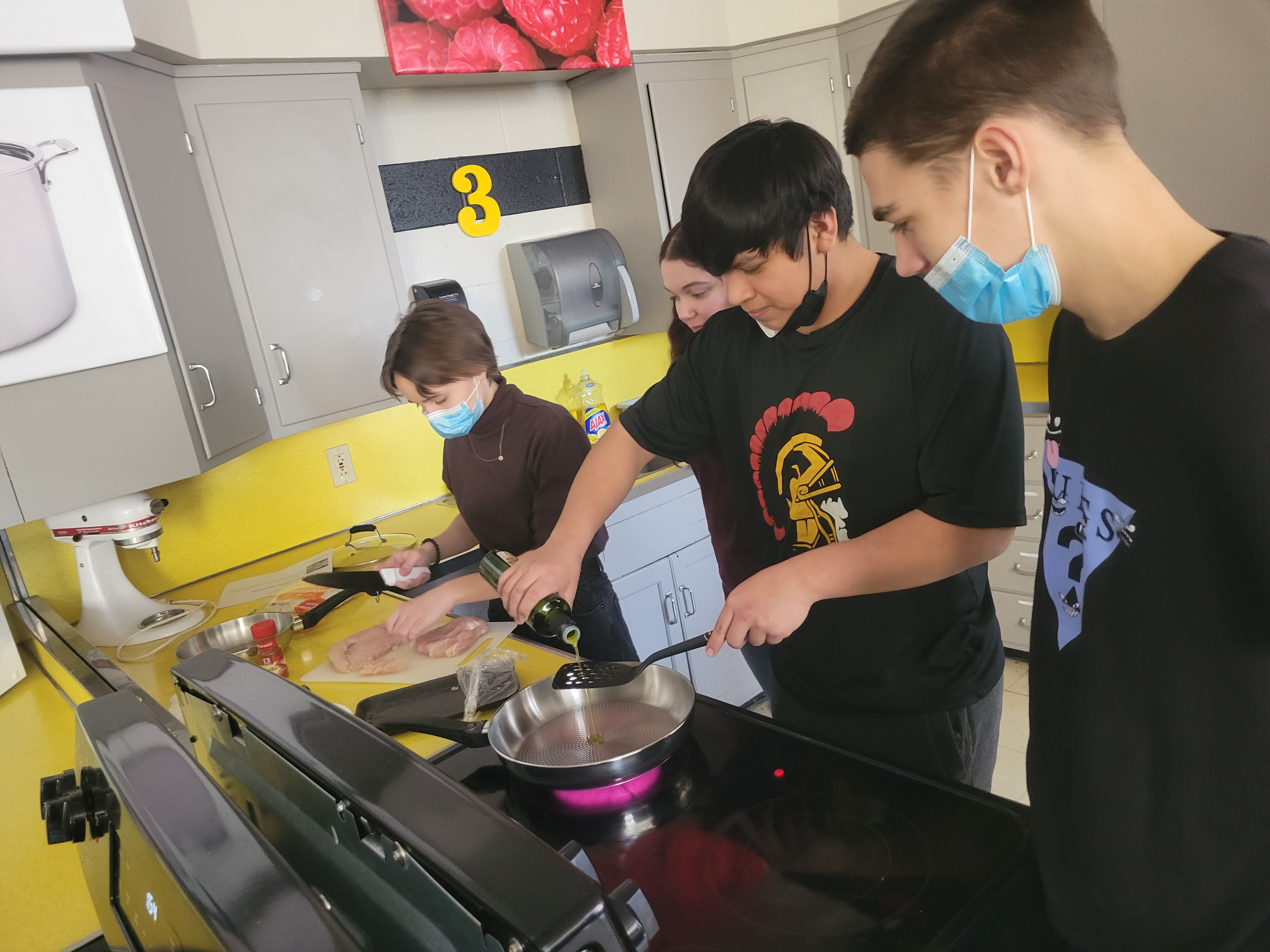 Students cooking on the stove