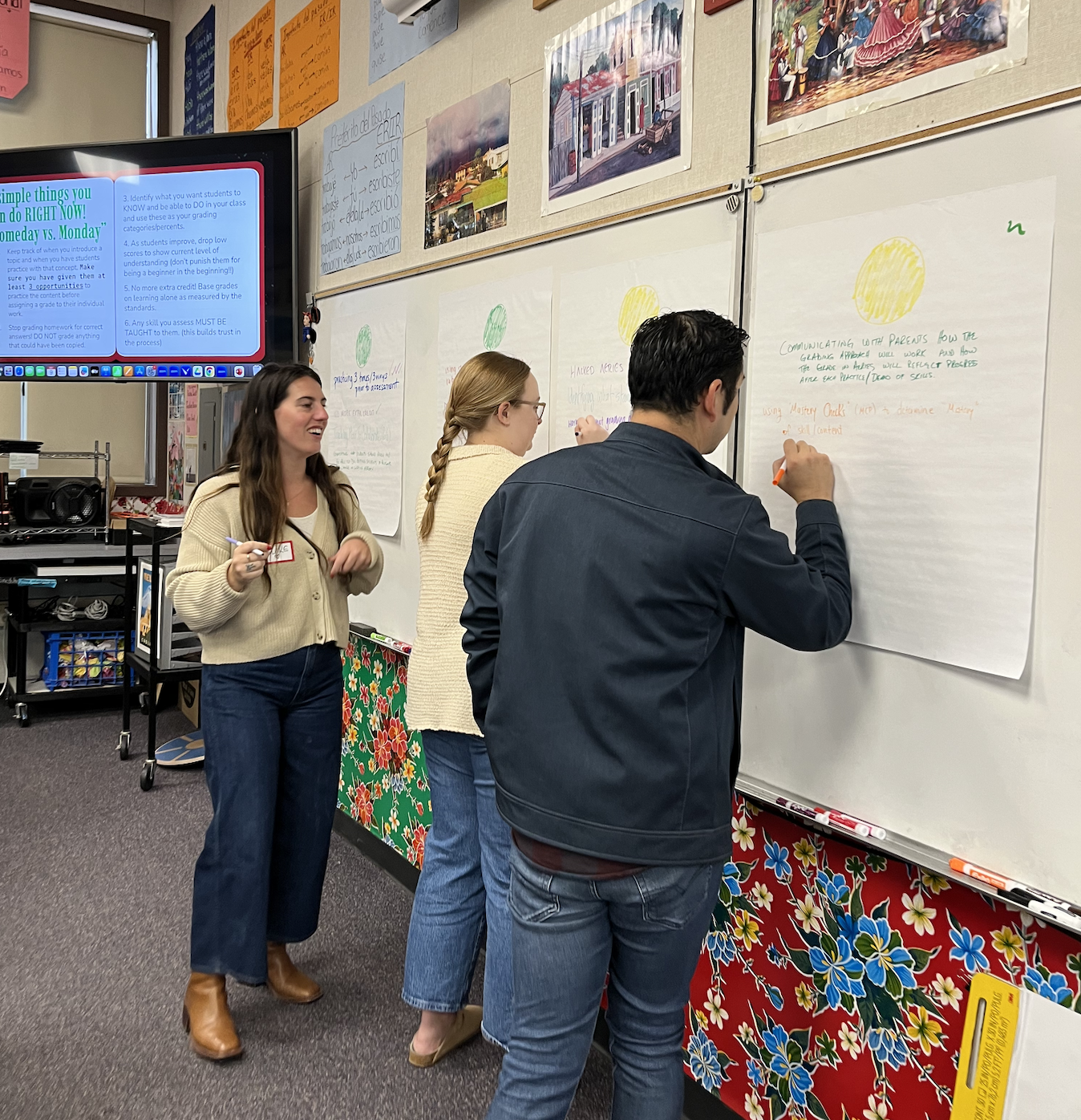 Staff writing what's working w/ standards based grading during pd day