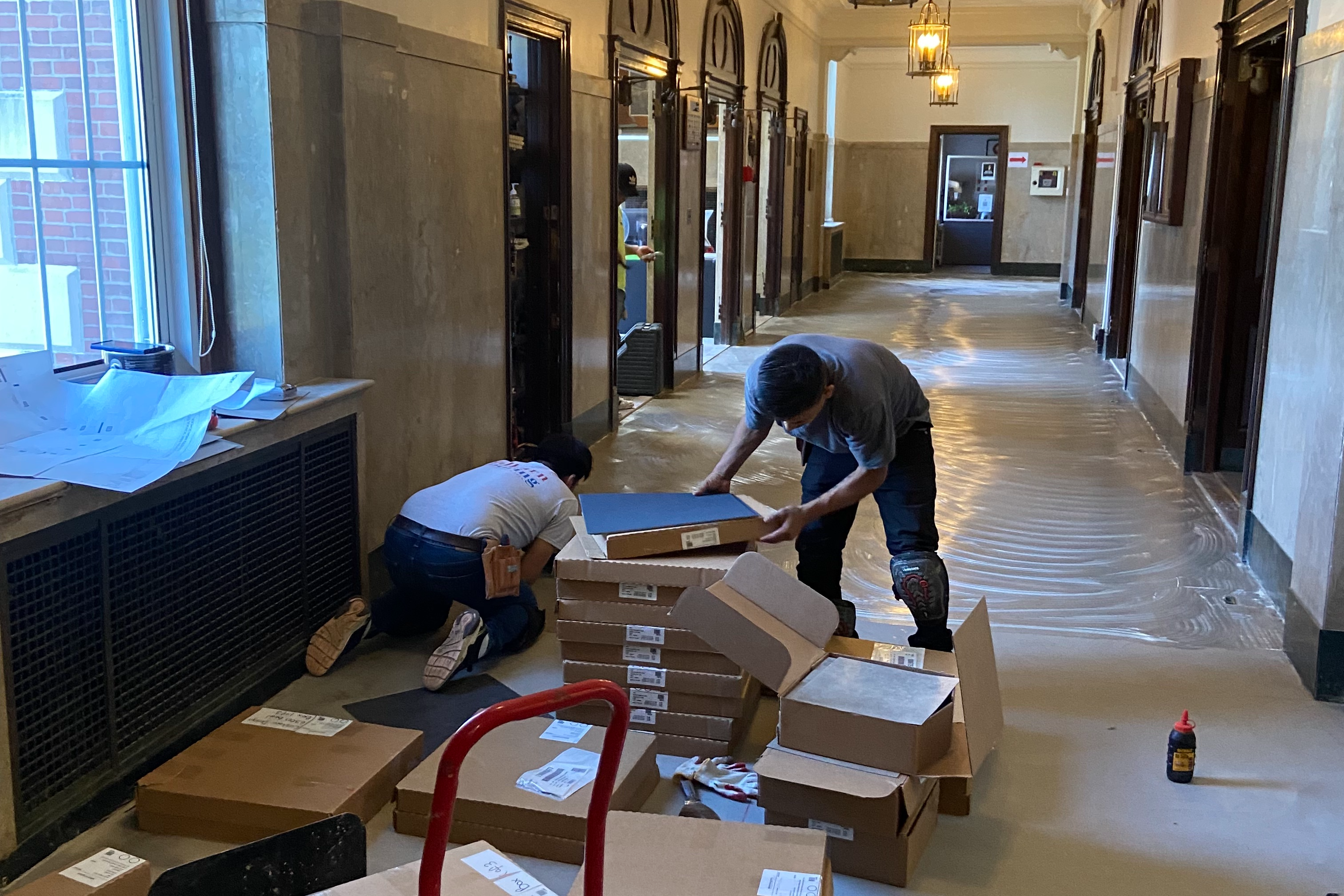 Workers unboxing new tiles