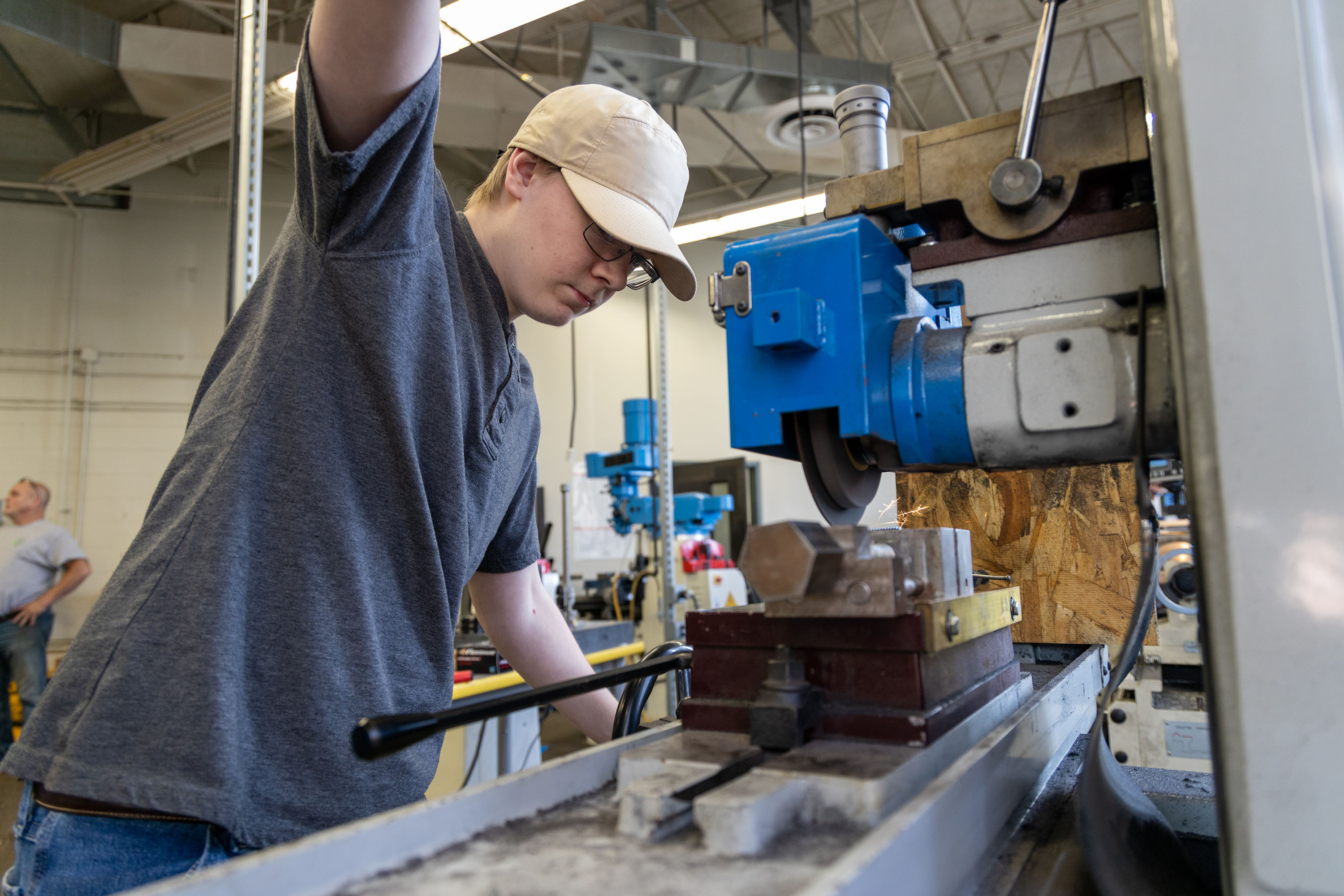Student using machinery in Advanced Manufacturing class