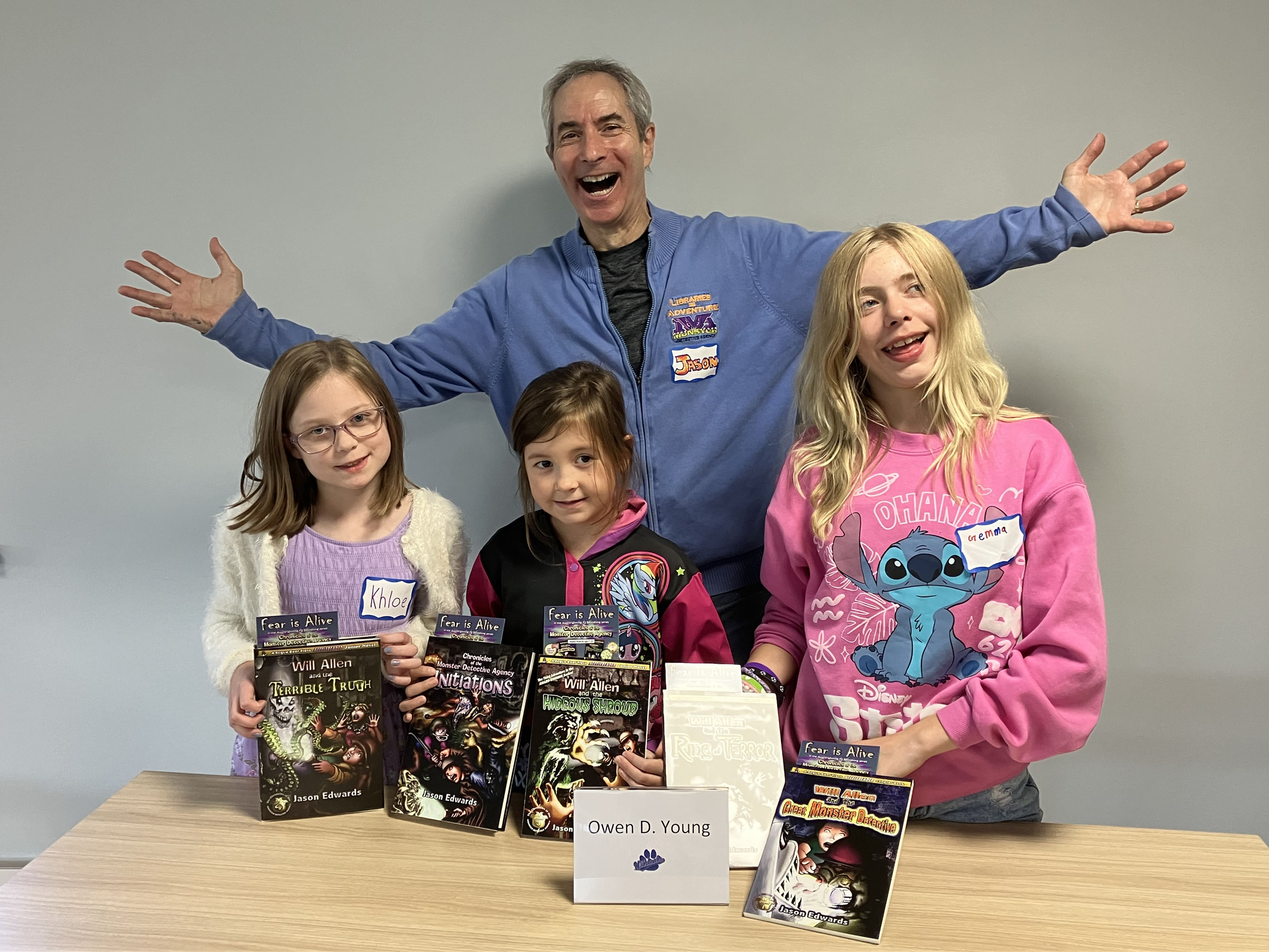 Three students with author Jason Edwards