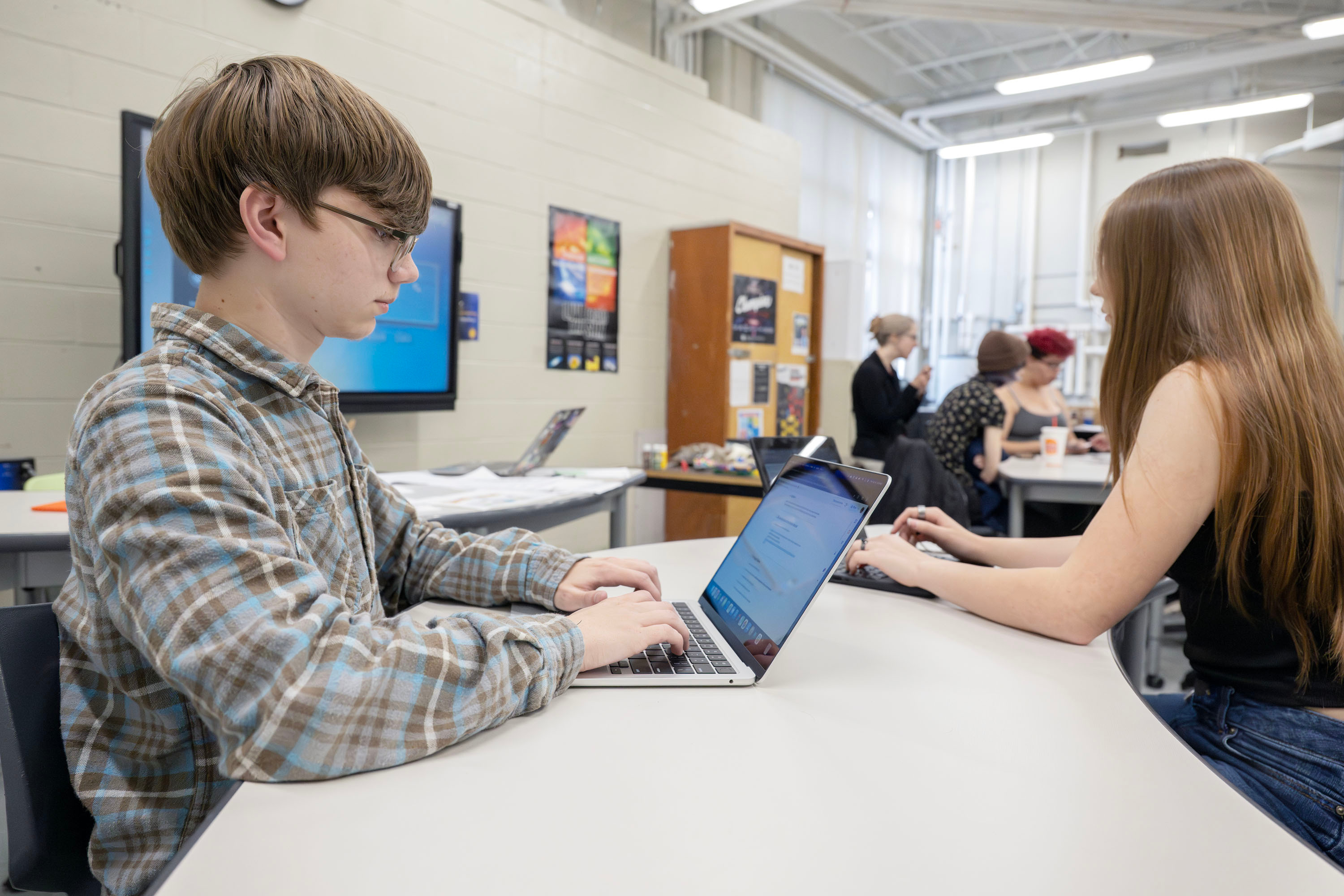 VP-TECH students at work on laptops