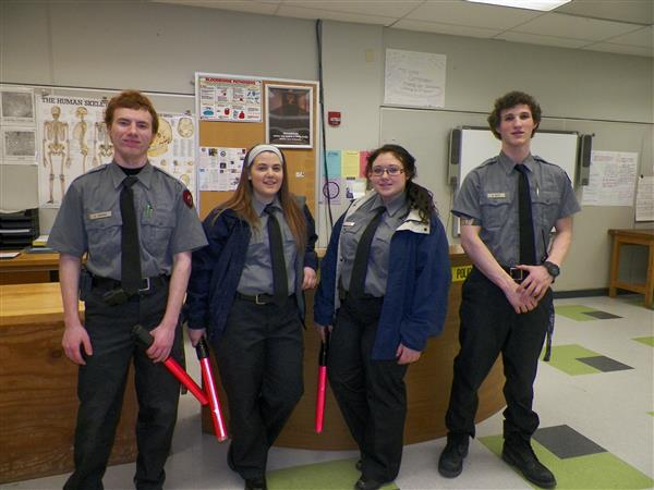 Four Criminal Justice students pose for a photo