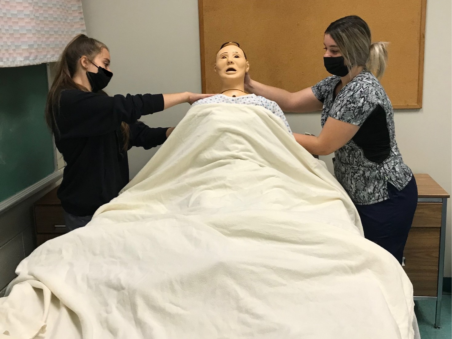 Health Science Careers students practice with a mannequin