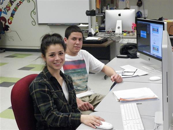Two Visual Communications Media Arts students in class