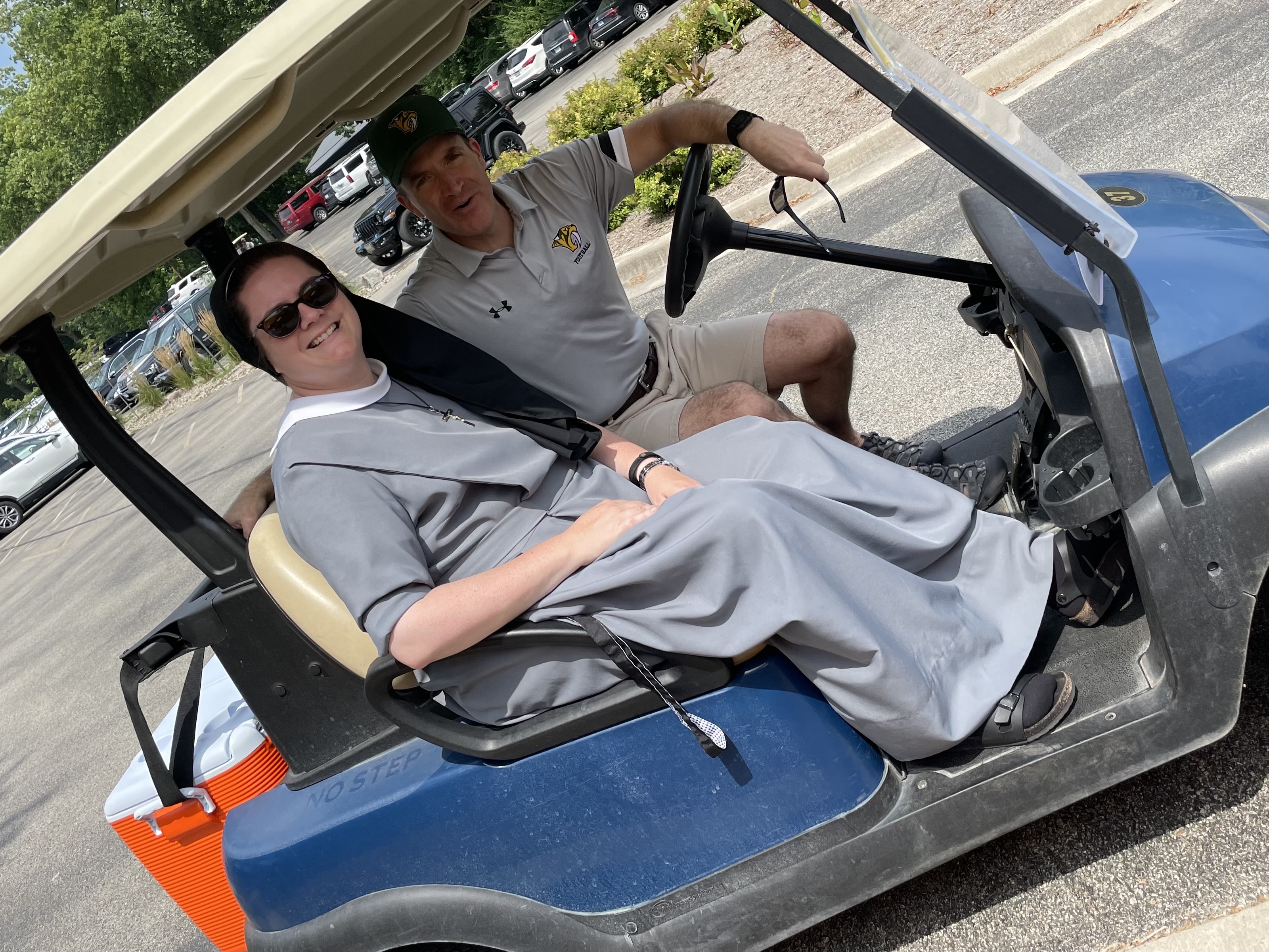 Sr. riding around at golf tournament