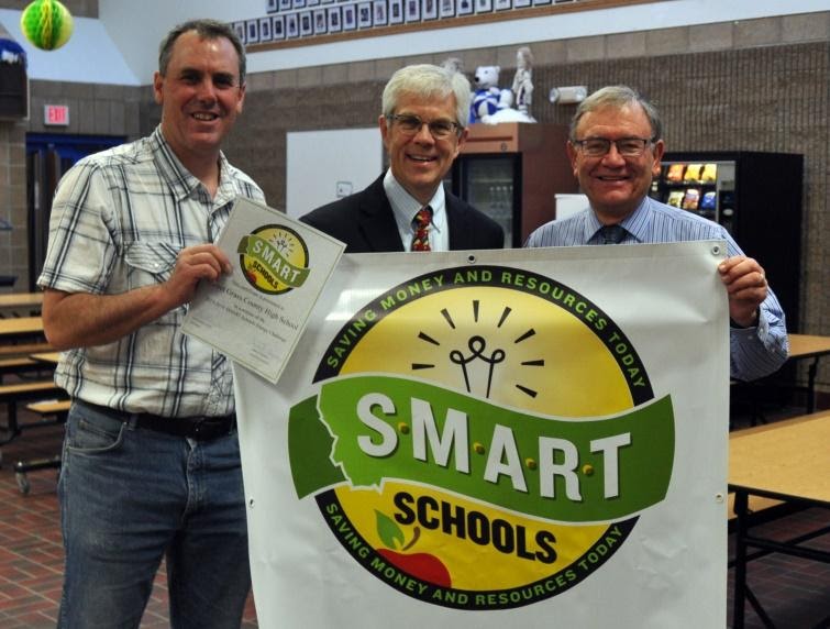 Group of people holding "Smart Schools" banner