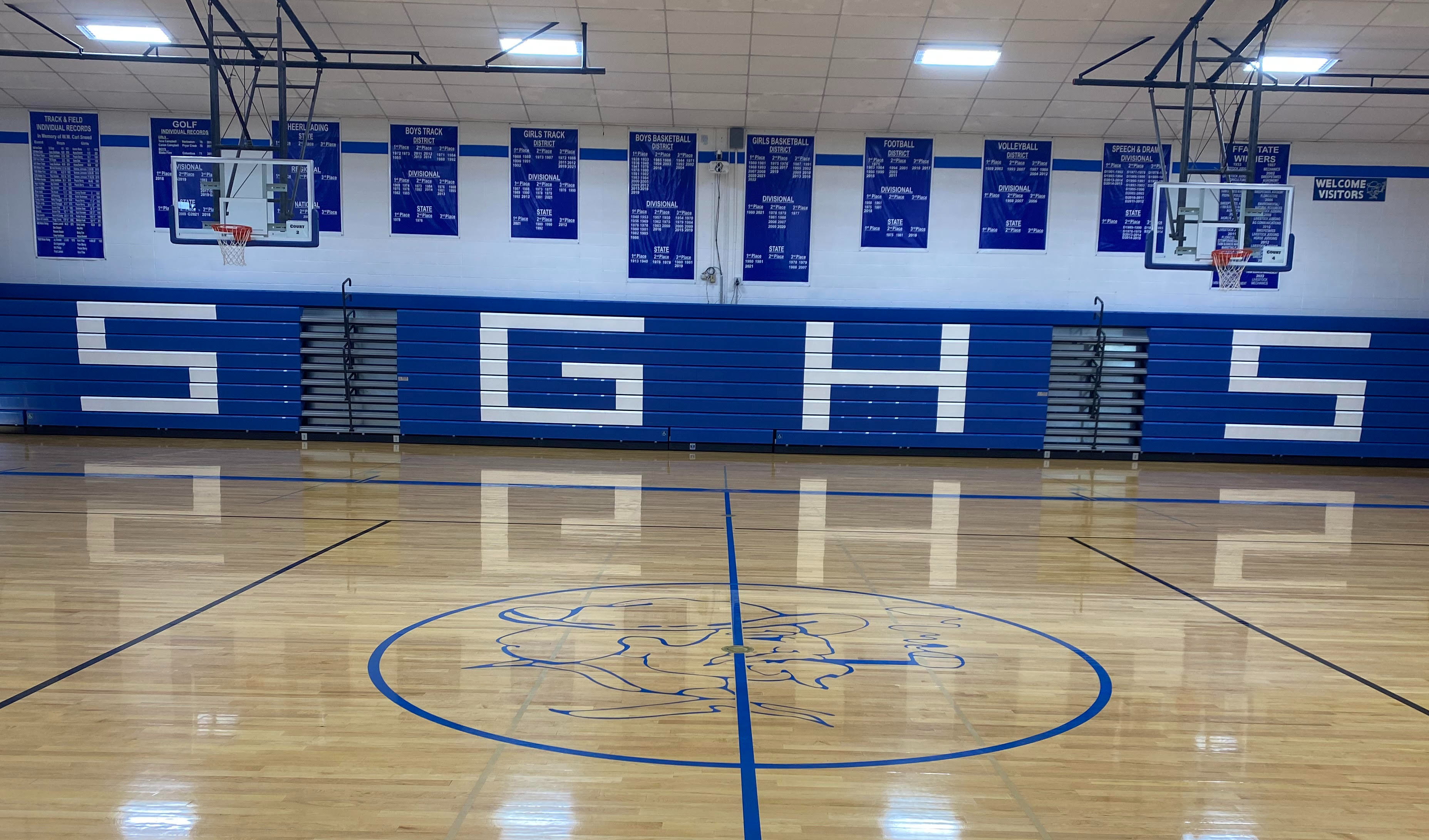 blue bleachers with SGHS written in white on them
