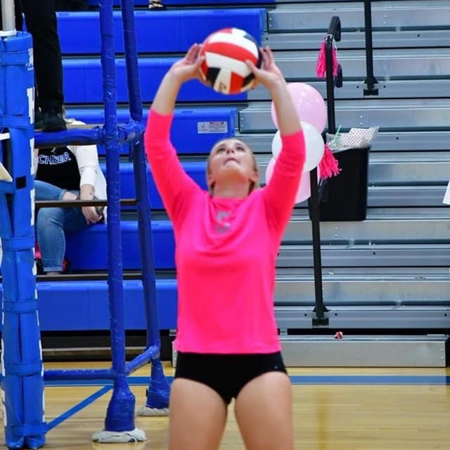 herder volleyball player setting the ball