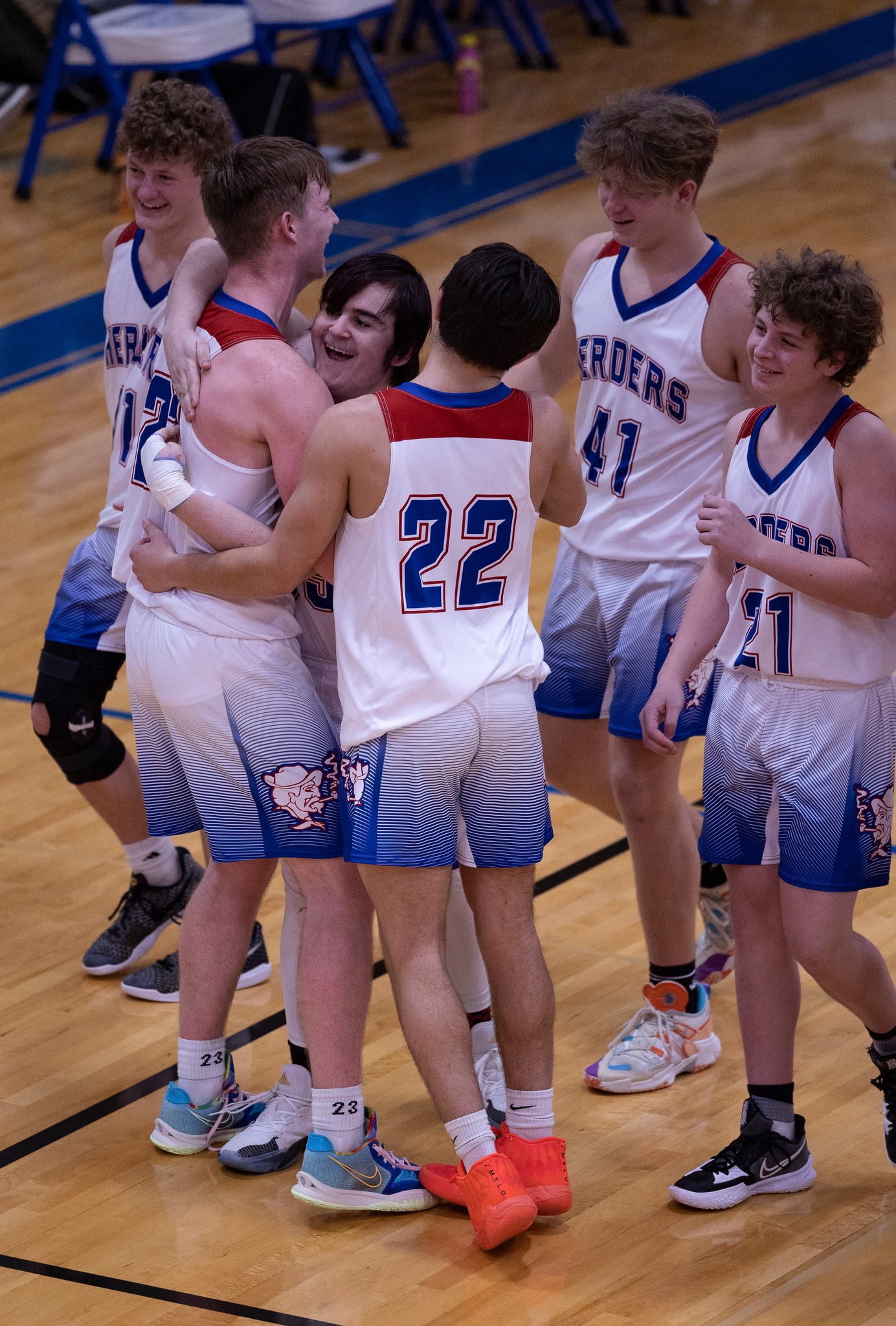 herder boys basketball payers celebrate after a game