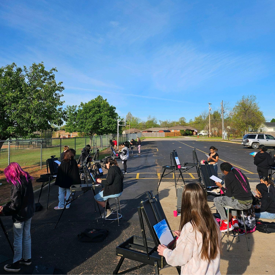 students painting outside