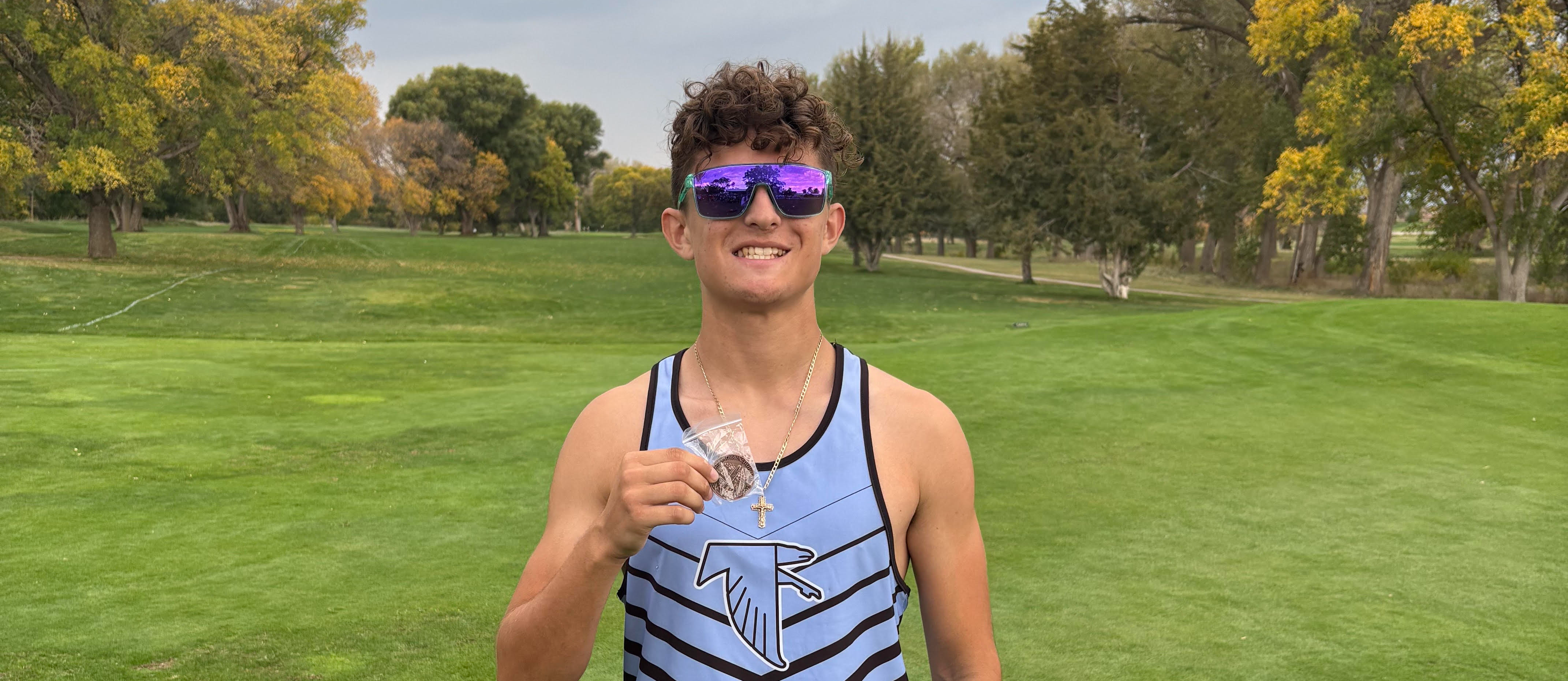 Alex- 8th place medal and qualifier for state cross country