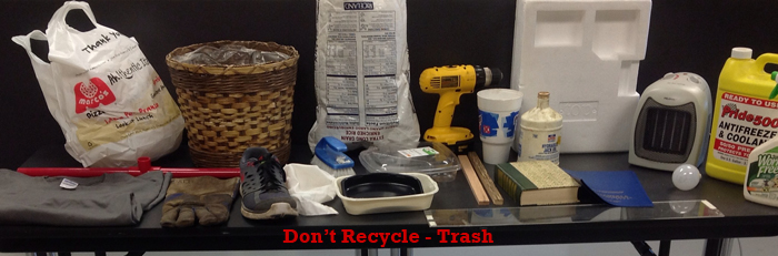 A picture of examples of trash, not recycling materials