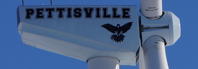 A closer up picture of the side of the windmill with Pettisville and logo on it