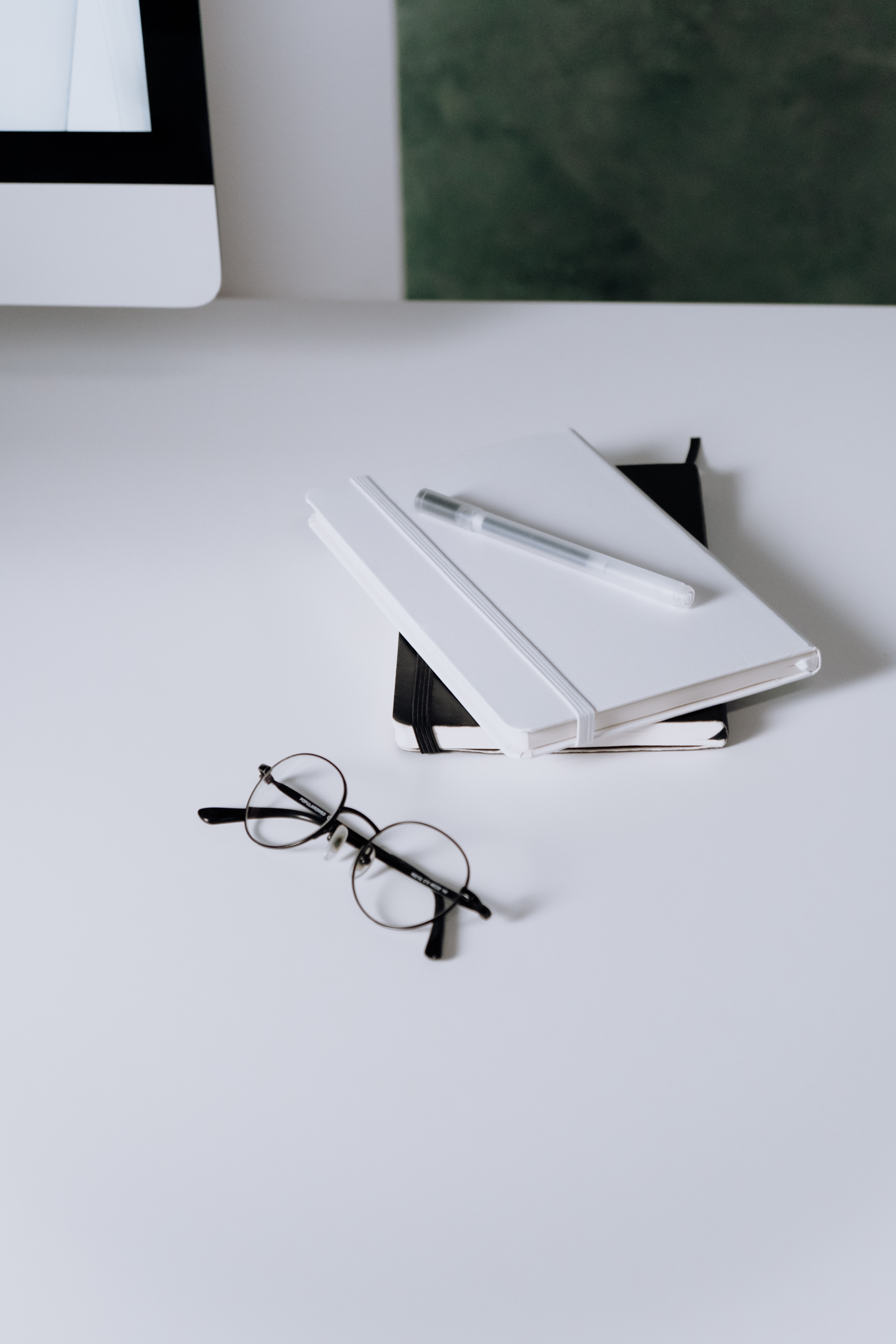glasses sitting on table with notebook