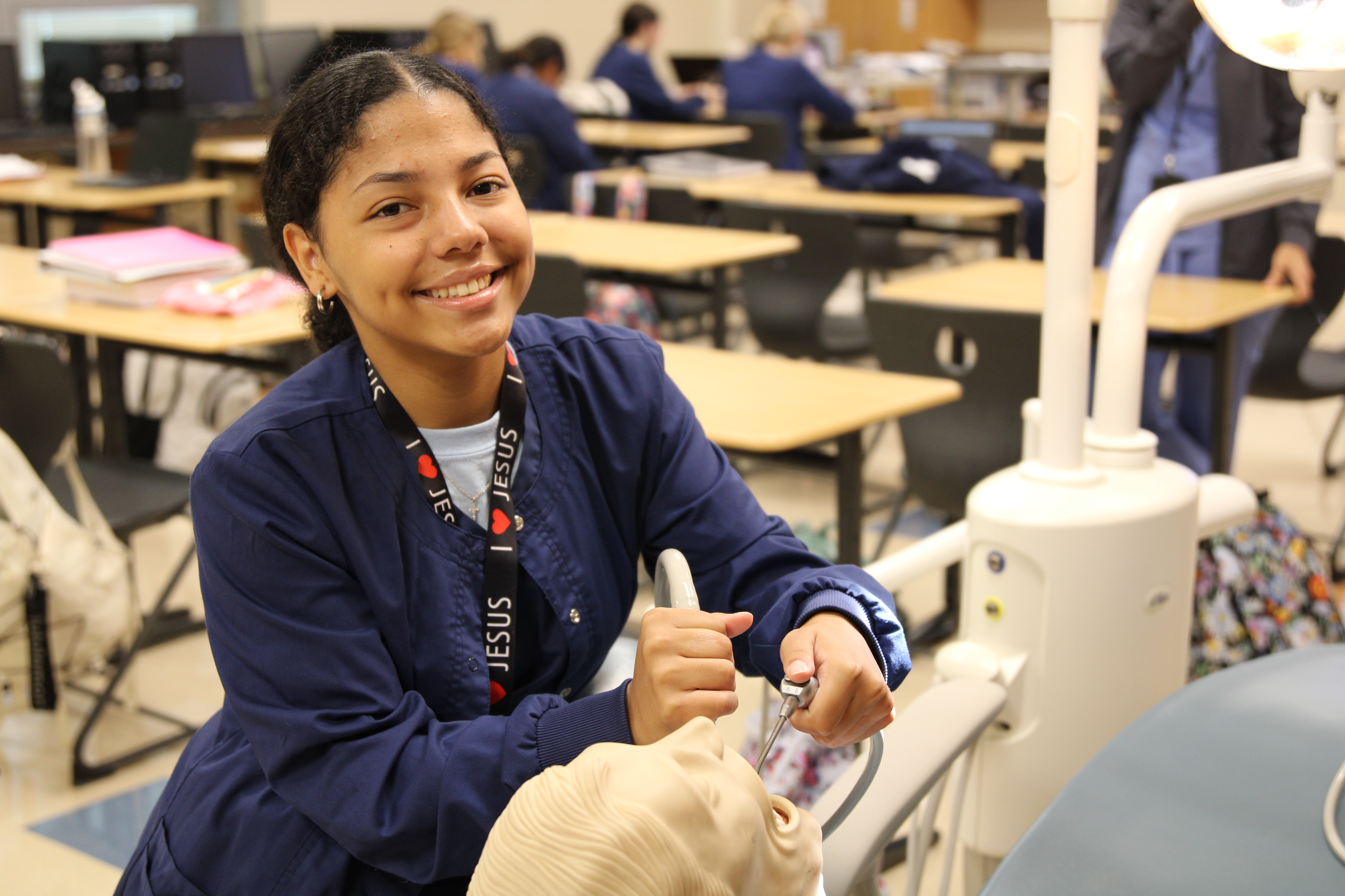 dental assisting students practicing in the classroom
