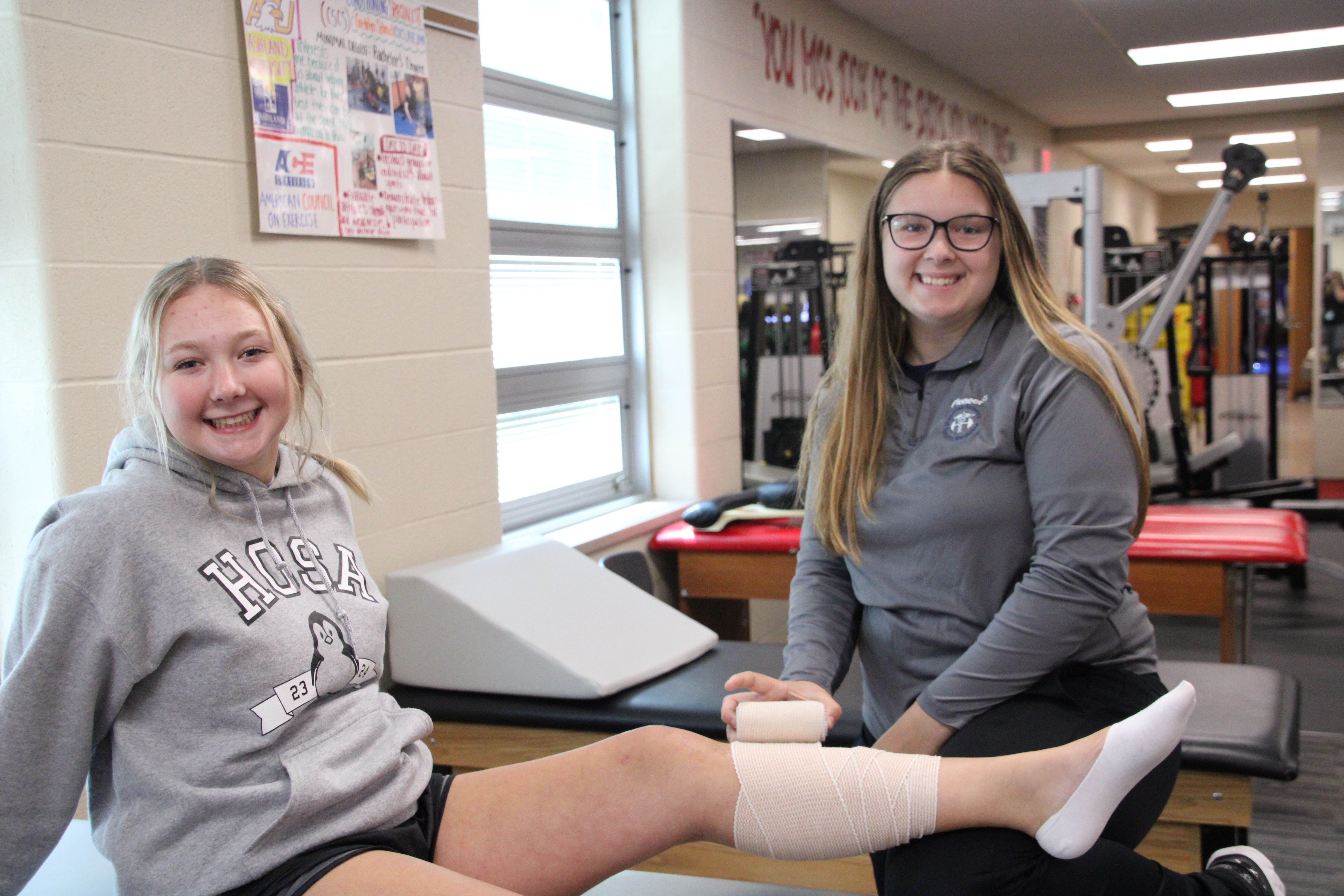 exercise science students practicing in the classroom